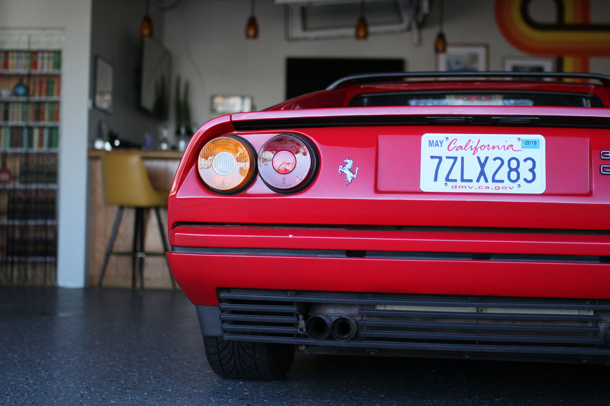The Ferrari 328 GTSi  beside Garage 77´s bar and music room