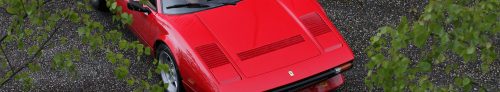 Ferrari 308 GTB QV behind the trees and leafs. Front page of Fascinating Cars