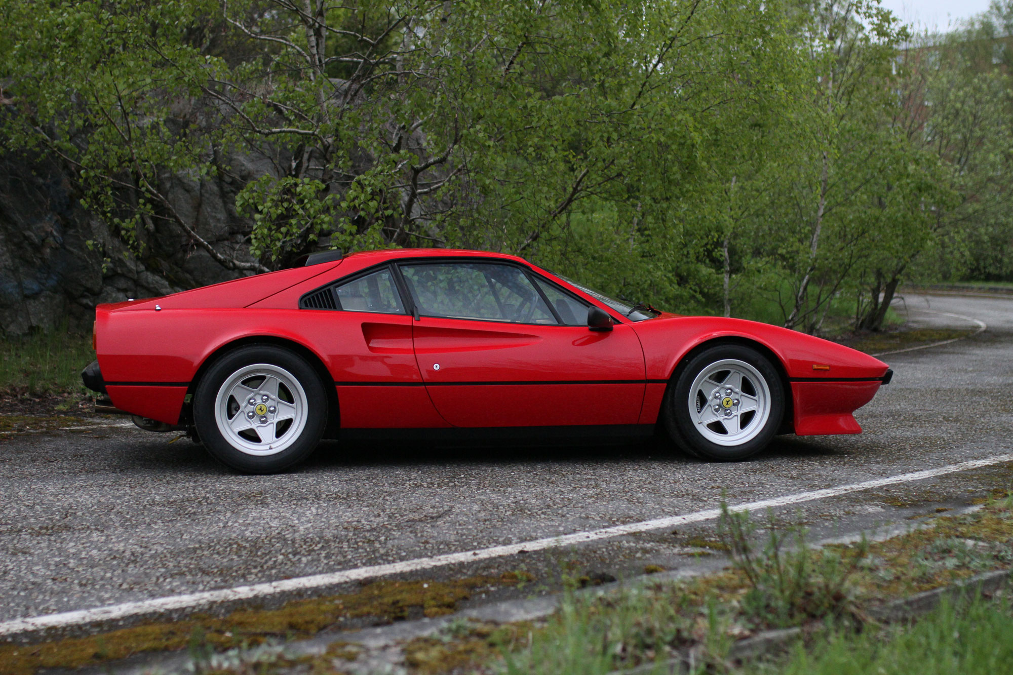 the profile of the iconic red Ferrari 308 GTB QV - 1984