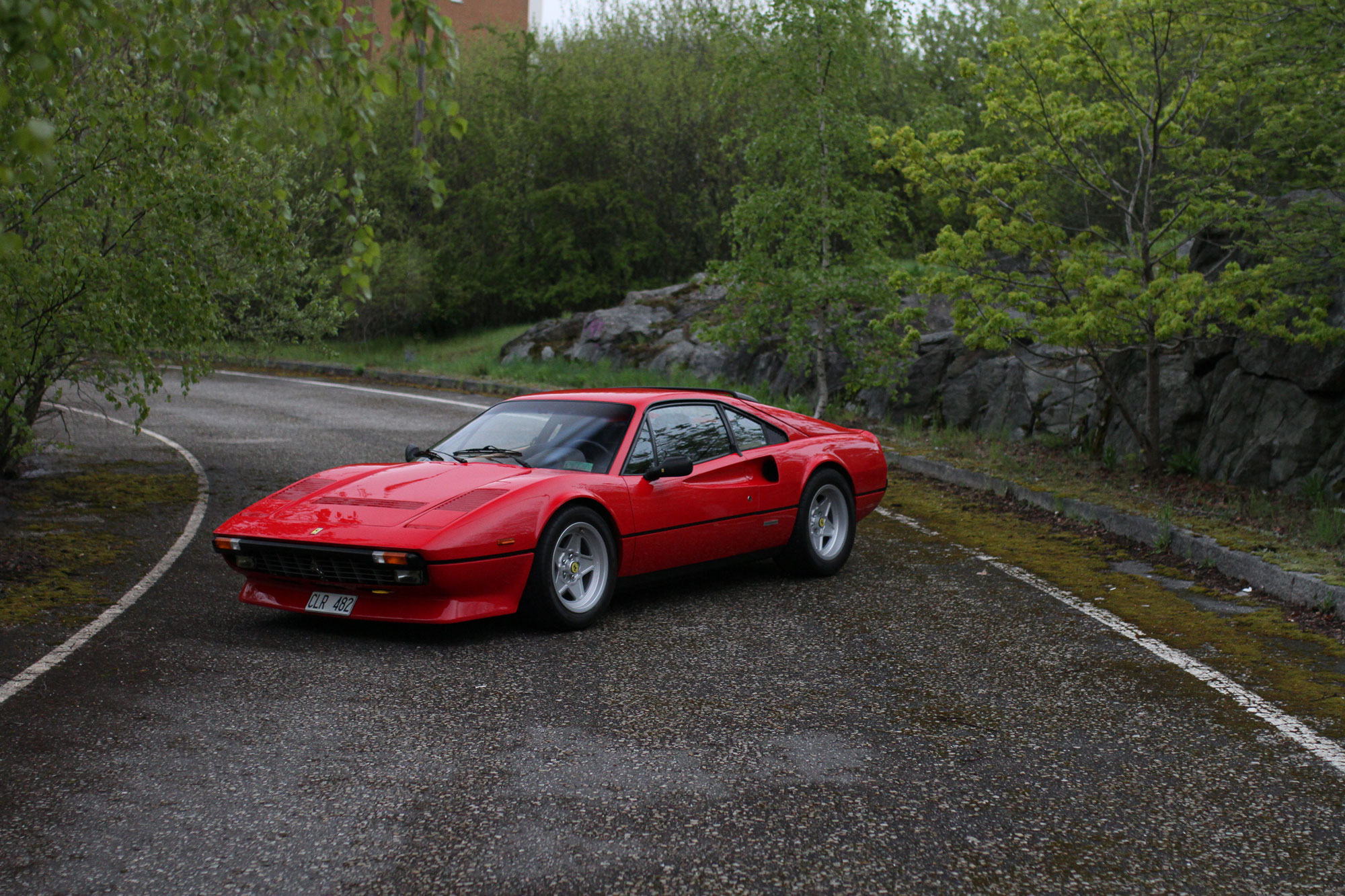 Deserted highway exit with a iconic red
Ferrari 308 GTB QV - 1984