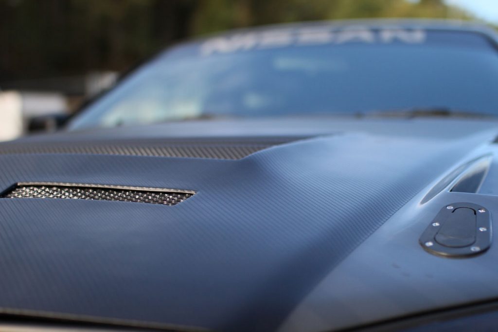 The hood of a Nissan Skyline R34 - 1998